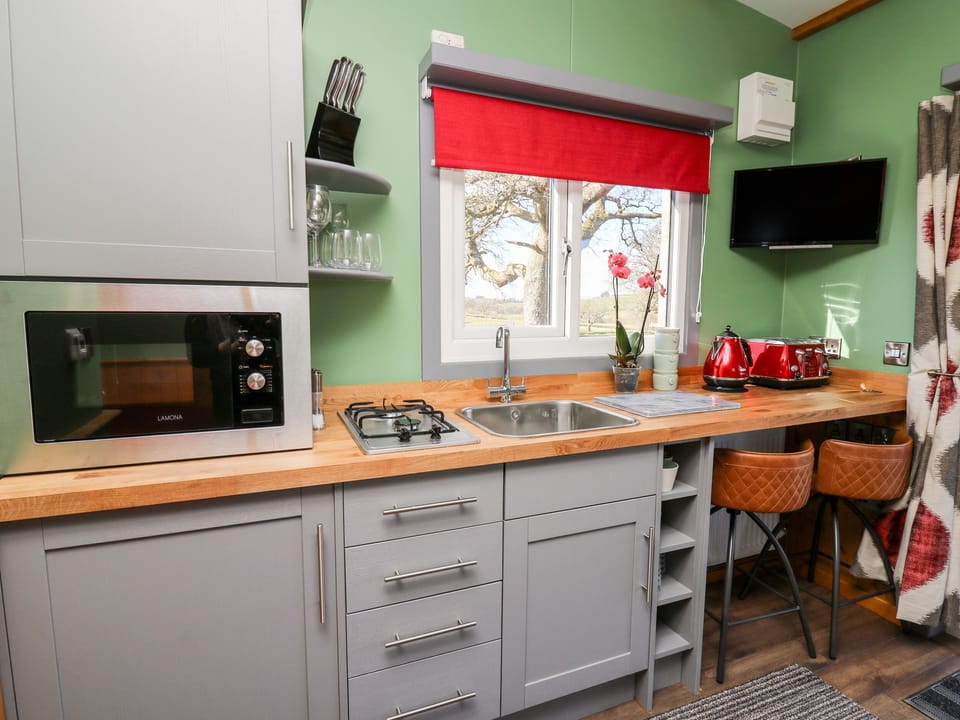 Fridge, electric kettle, cookware/dishes/utensils