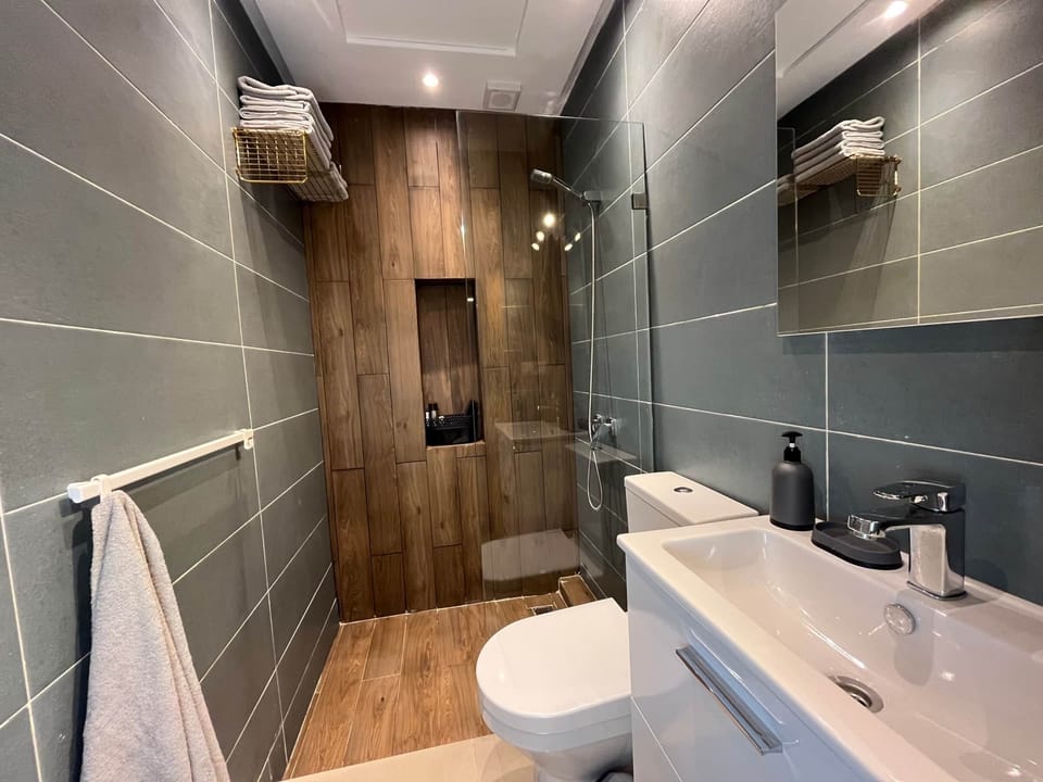 Get a hot shower in the bathroom.