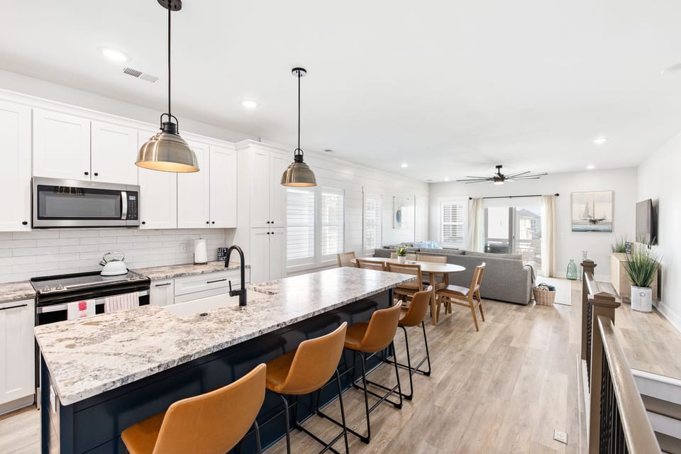 A bright, modern & open space kitchen and living room space 