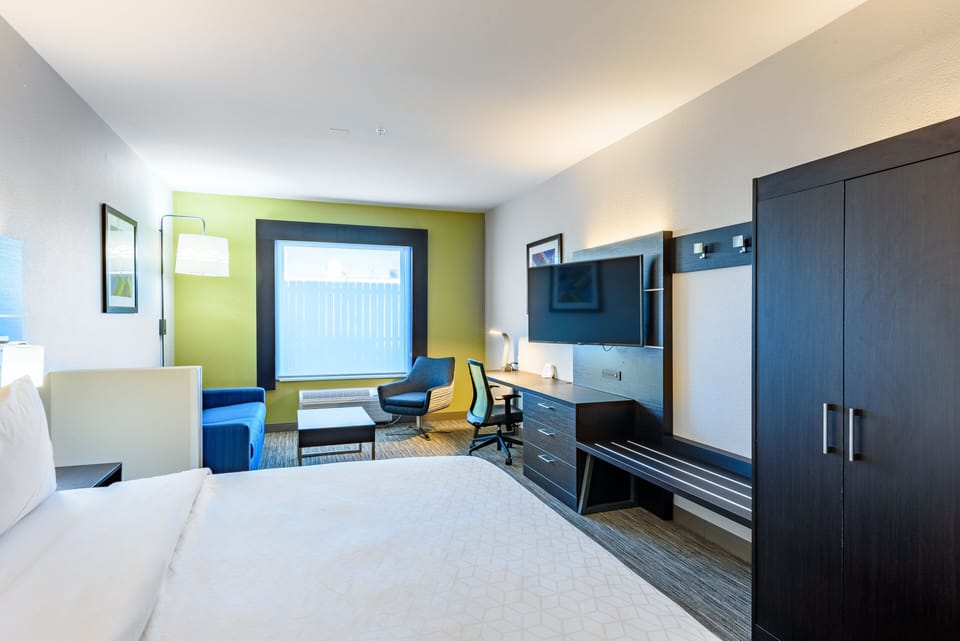 Desk, laptop workspace, iron/ironing board, cribs/infant beds