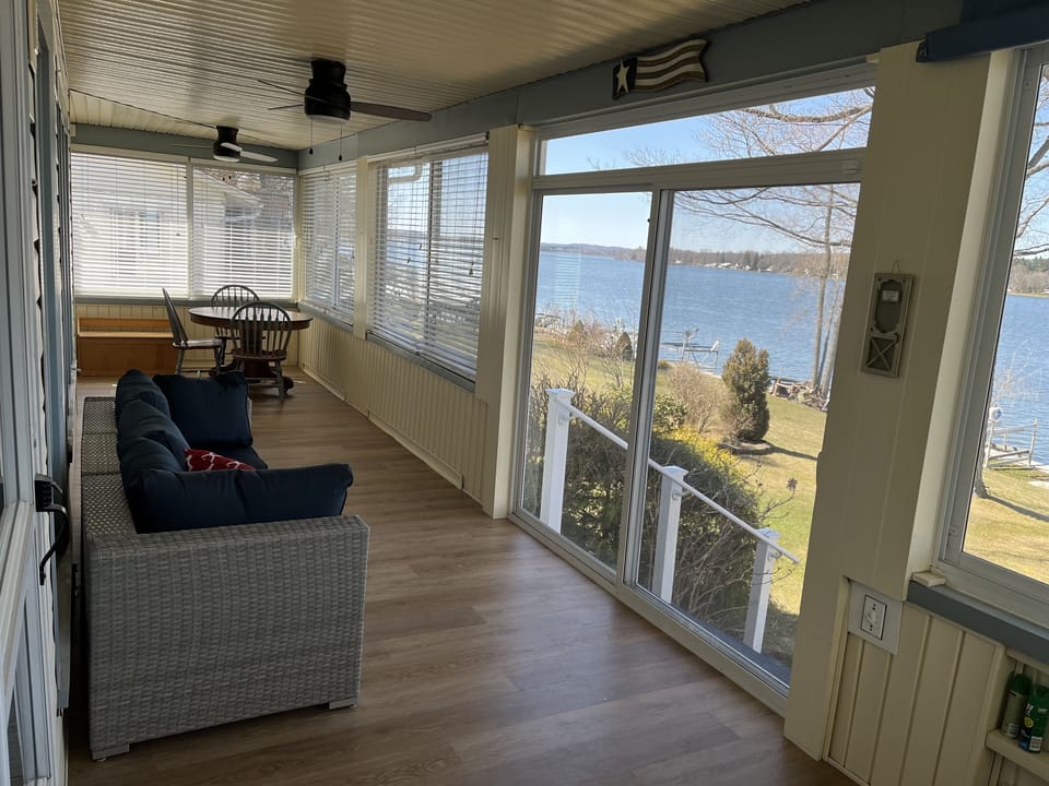 Screened in porch with view of the lake. 