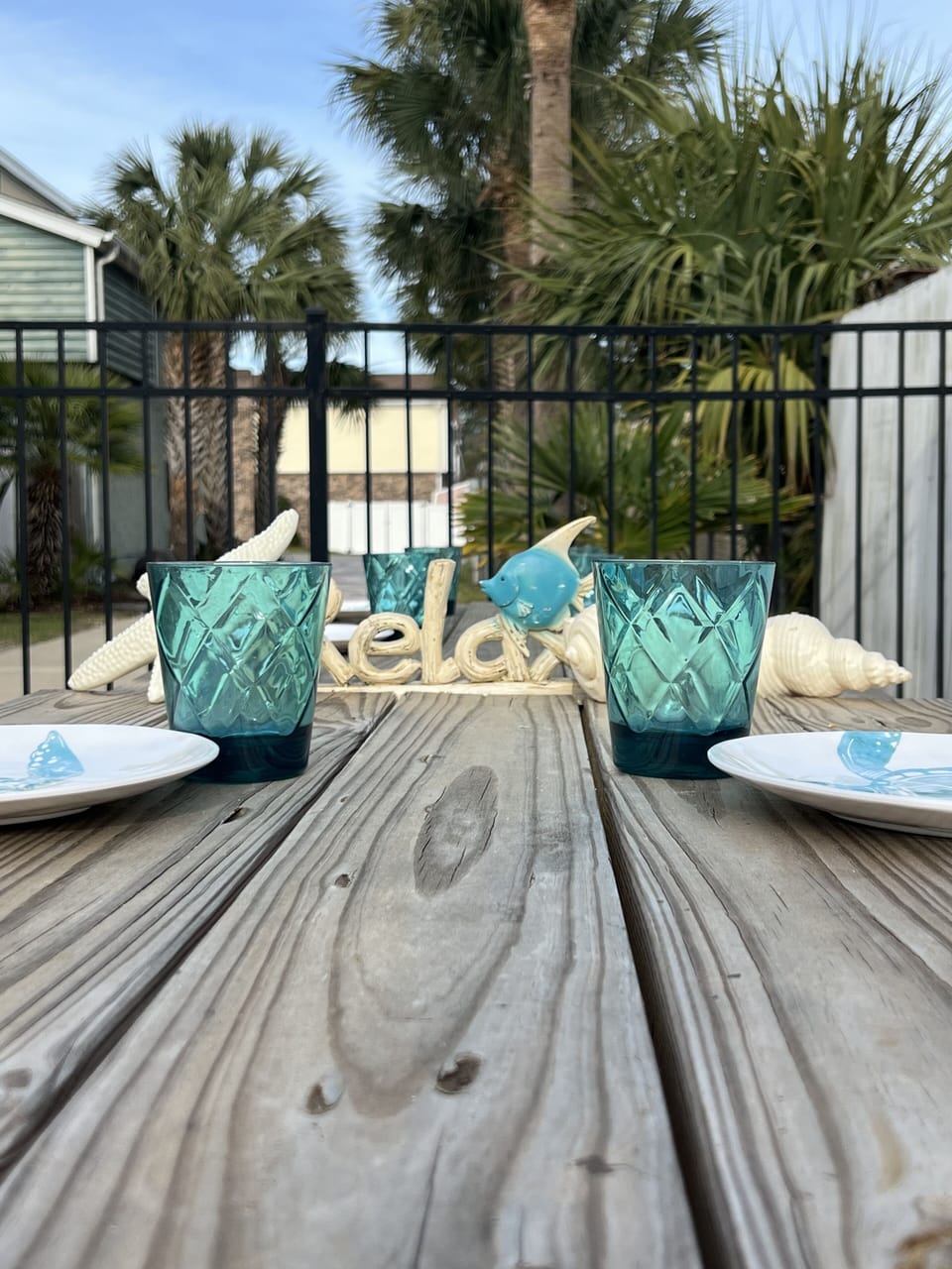 2 Wooden picnic tables are perfect for beach dinners. Melamine dishes & tumblers