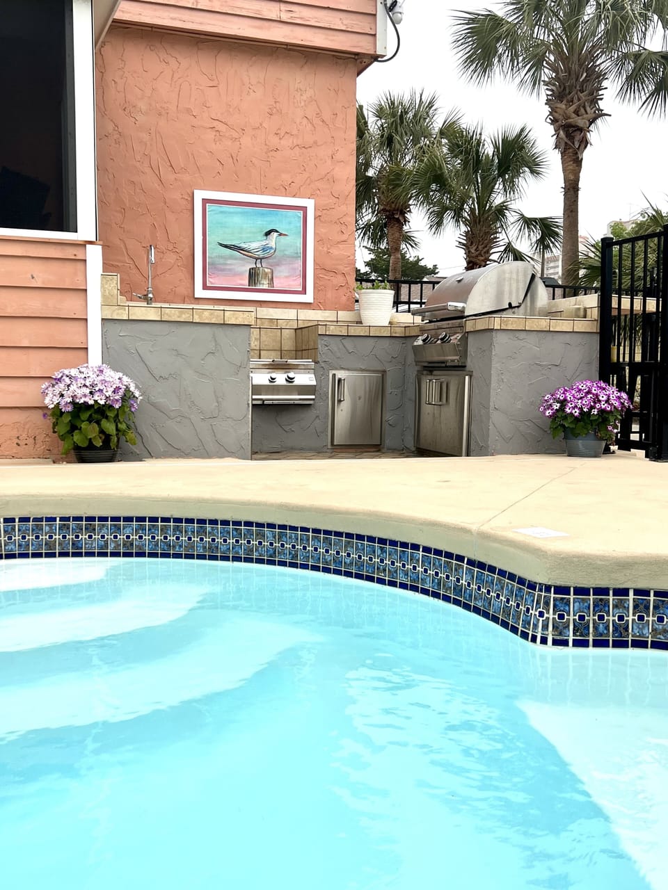 Full outdoor kitchen complete w/Low Country Boil, Sink, Fridge, Bar and Grill. 