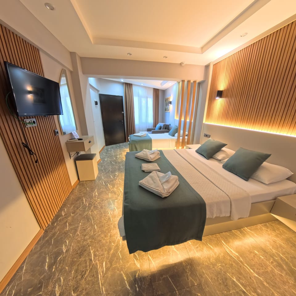 Family Quadruple Room, 1 Bedroom, Non Smoking, Pool View | Premium bedding, free minibar, individually decorated, desk