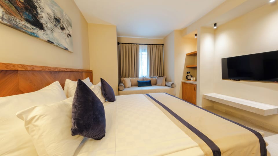 Family Suite | Minibar (free items), in-room safe, desk, laptop workspace