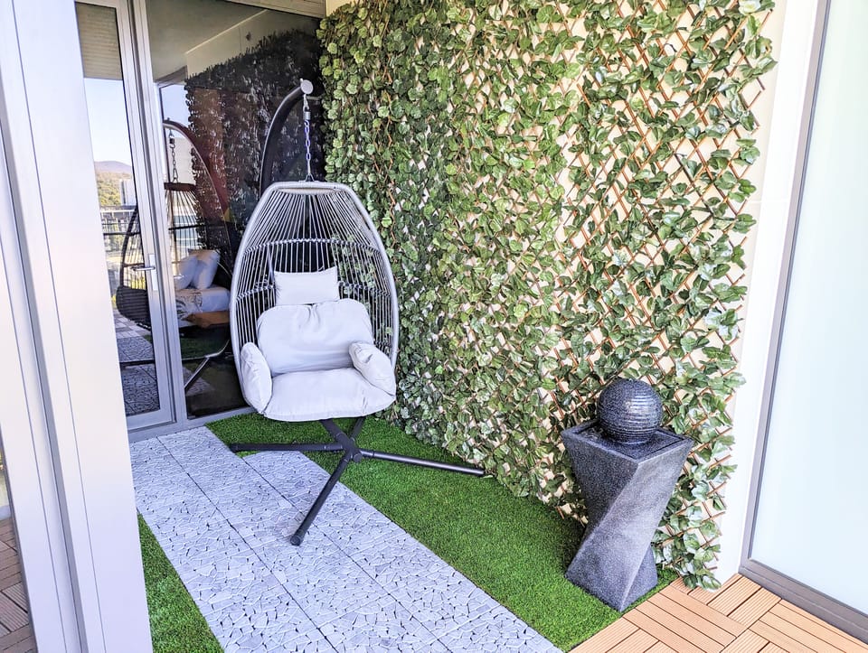 Relax on our swinging egg chair while listening to the soothing water feature