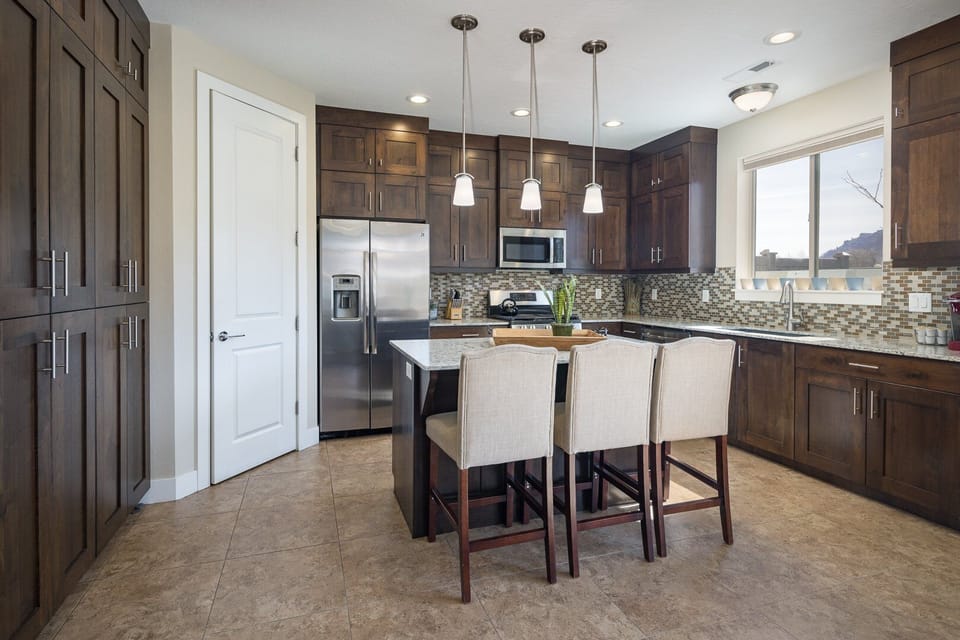 Clean and Organized Kitchen Area with state of the art kitchen equipment and An Island countertop