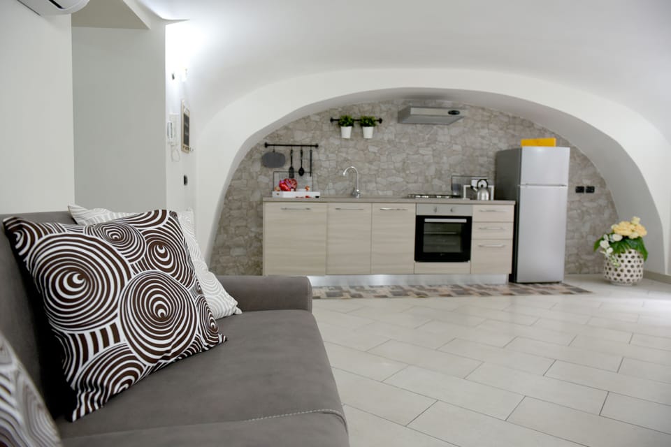 Family Apartment | Living area | 36-inch Smart TV with satellite channels