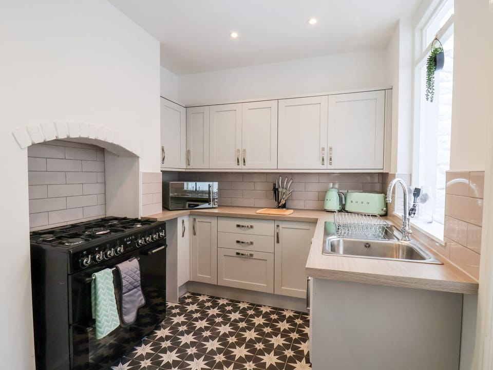 Fridge, electric kettle, toaster, cookware/dishes/utensils