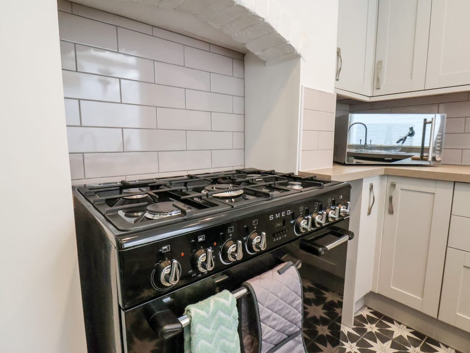 Fridge, electric kettle, toaster, cookware/dishes/utensils