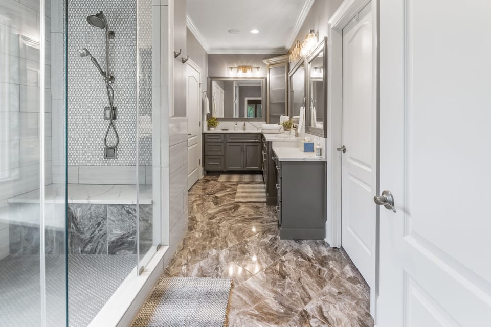 Master Bathroom with double sinks, tons of counter space, and huge double shower
