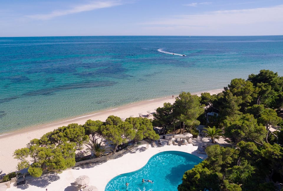 Private beach, white sand, sun loungers, beach umbrellas