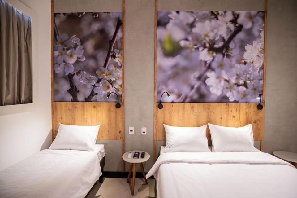 Family Triple Room | Memory foam beds, minibar, individually decorated, desk