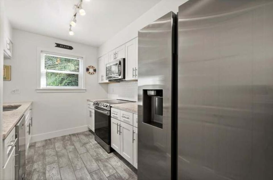 Beautiful stainless steel appliances in the light and bright kitchen.