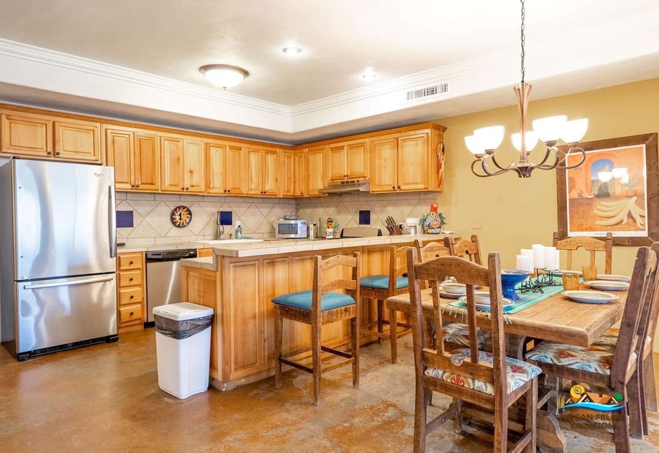 The kitchen at Casa Sonora comes fully equipped with everything you need — oven, microwave, large refrigerator, toaster, blender, and essential cookware.