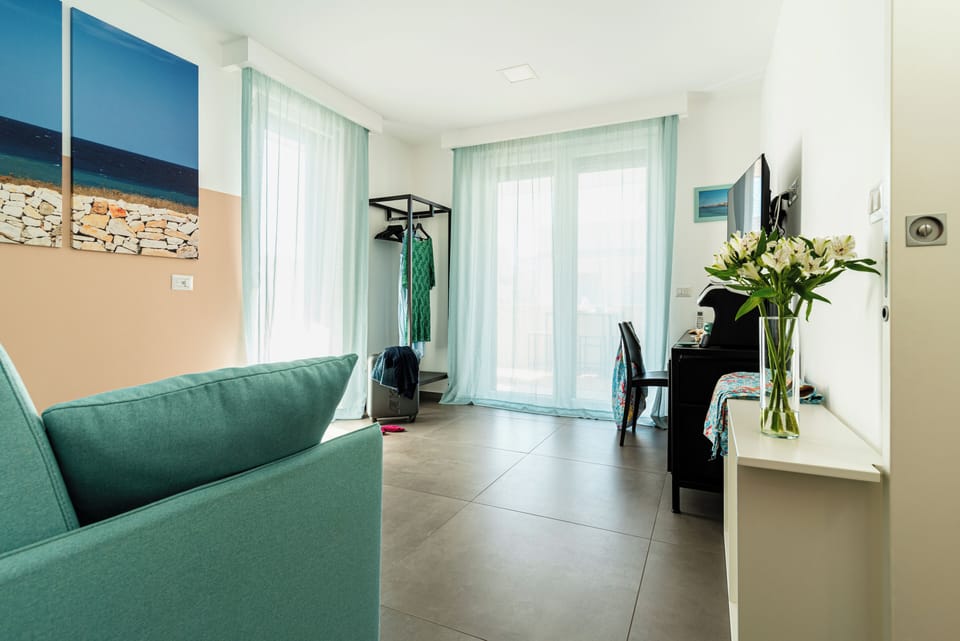 Family Suite | Living area | 42-inch Smart TV with digital channels, TV