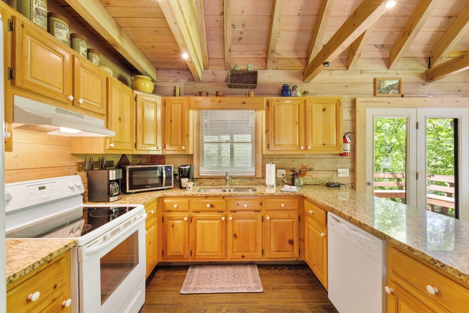 The fully stocked kitchen offers plenty of space to cook, gather, and enjoy meals together