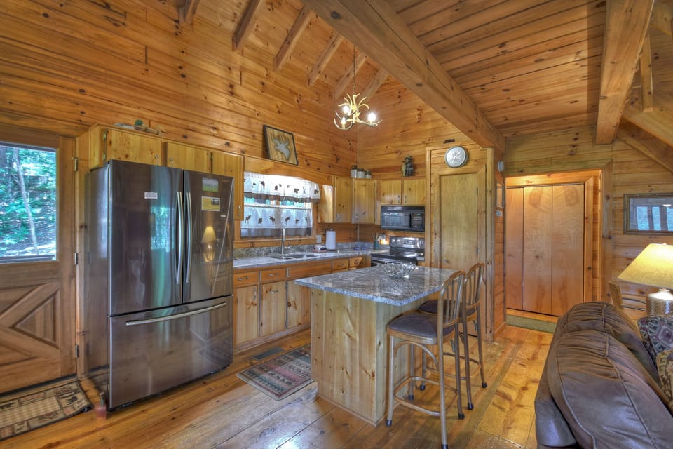 Fully Stocked Kitchen and a nice island area to prepare and serve your meals