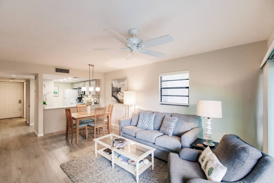 Living area, showcasing the Living area and dining area with the kitchen & entrance in the background