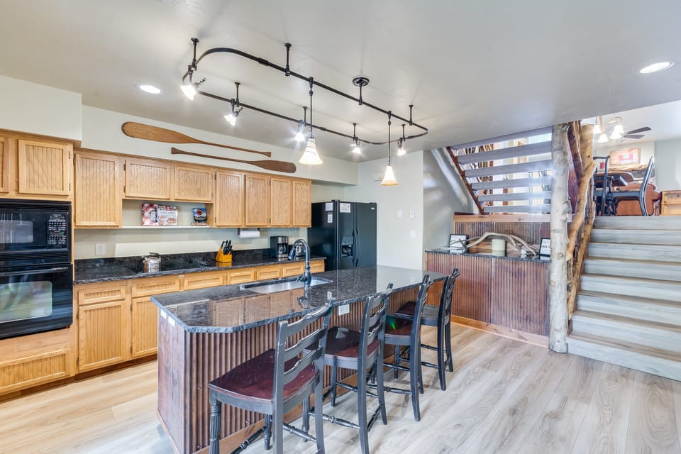 Large Kitchen with island seating, walk in pantry and all appliances needed for cooking
