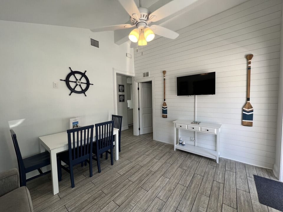 Living room with dinning table and queen sofa-bed