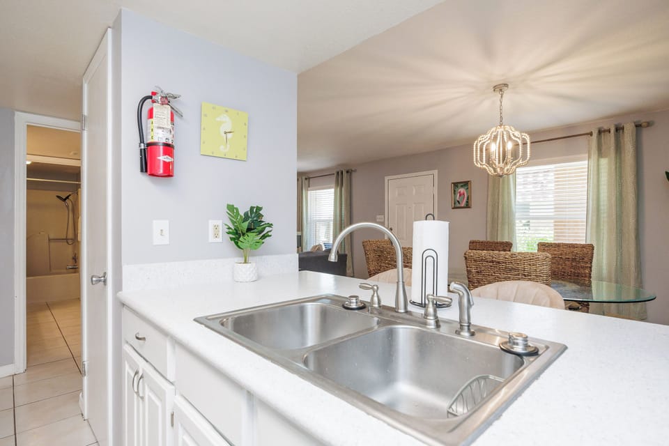 Prepare your favorite meals in this bright, open kitchen with stainless steel sink and easy access to dining.