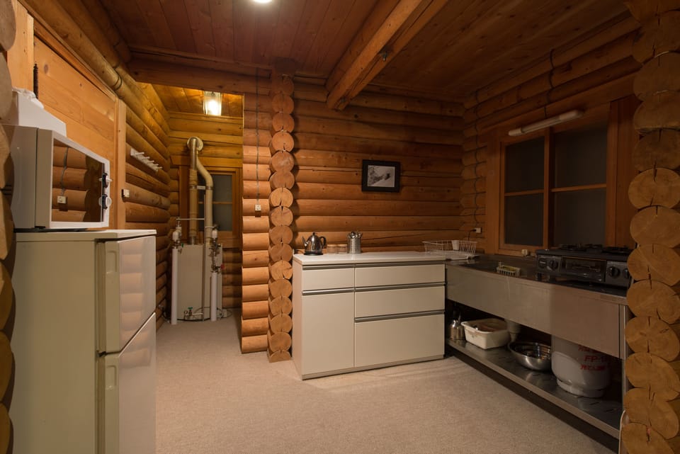 Cottage | Private kitchen | Shared fridge, microwave, highchair