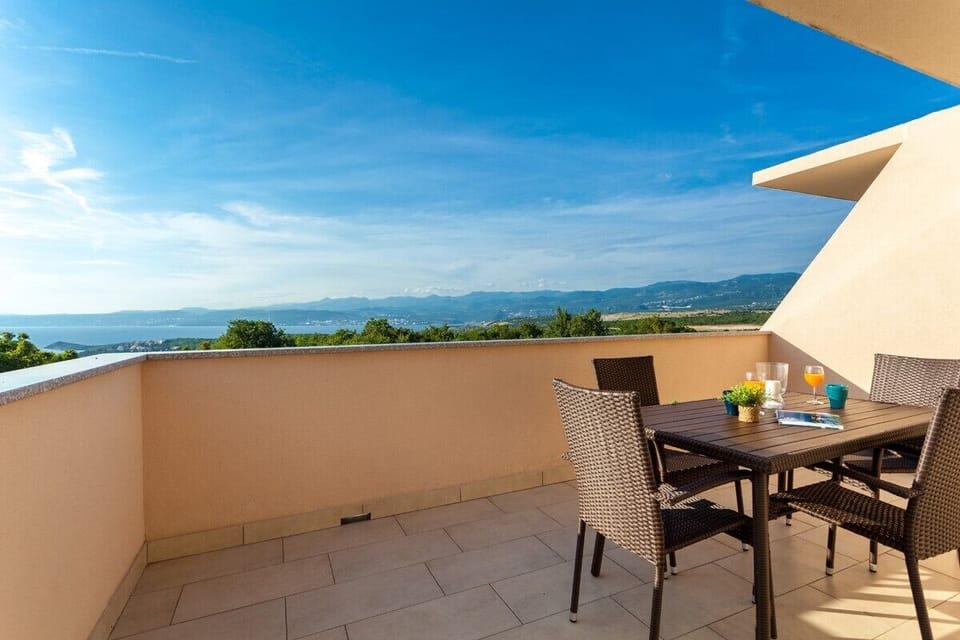 Spacious terrace with a breathtaking view of the sea and Kvarner Bay, perfect for relaxing and enjoying nature.