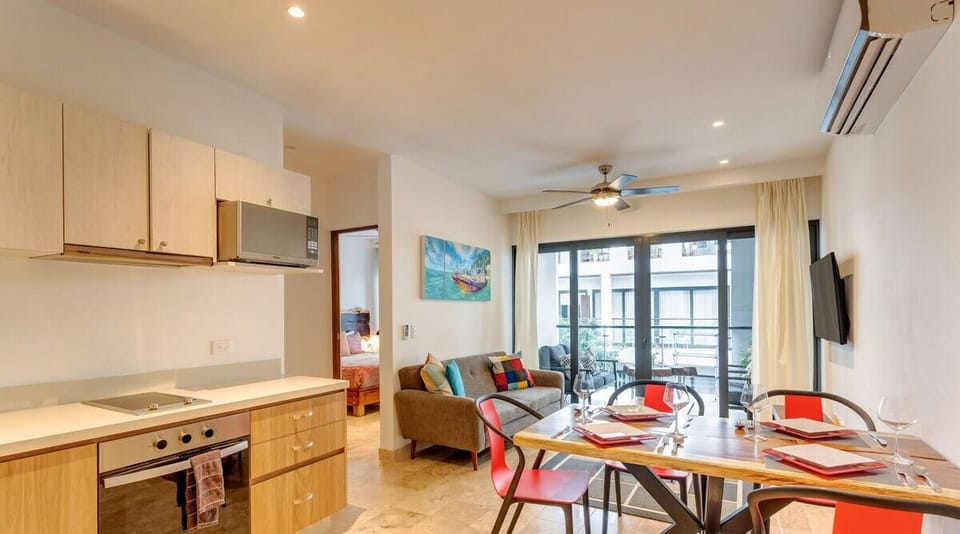 Modern kitchen, dining, and cozy living space. Your Playa paradise awaits!



