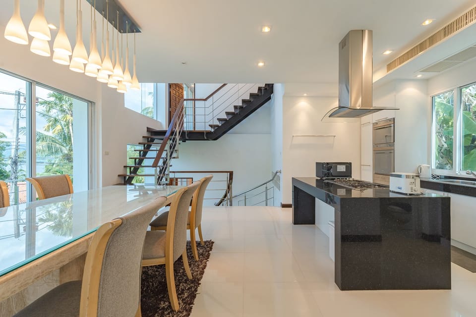 Stairs to middle floor where kitchen, dining and 2nd bedroom are located.