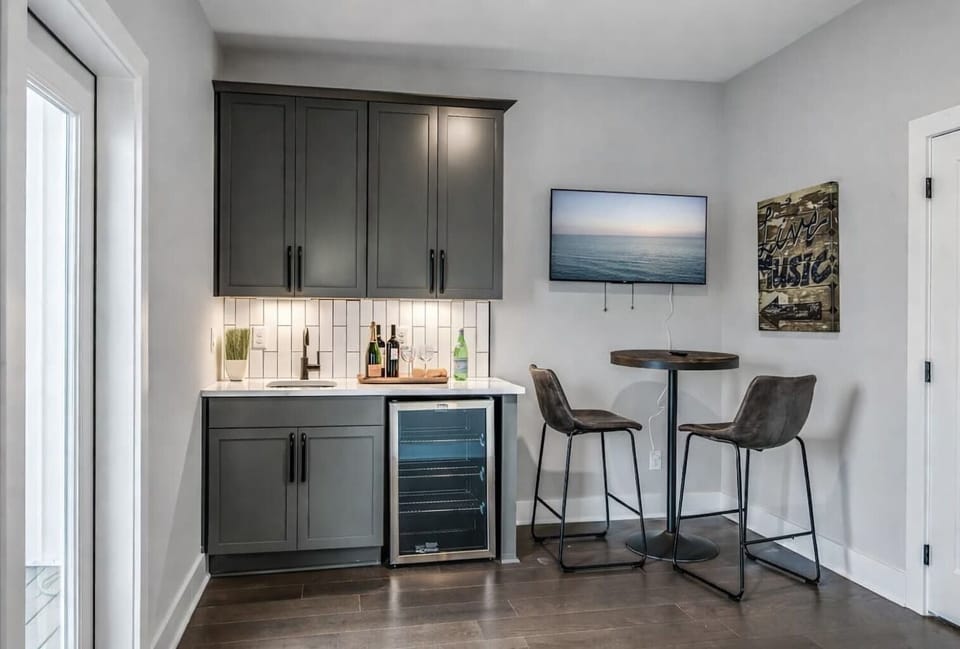 Entertain with ease thanks to the wet bar and rooftop patio access