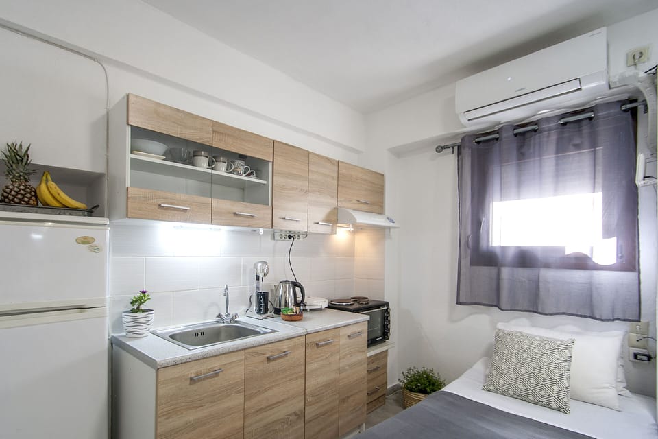 futon bed next to kitchenette