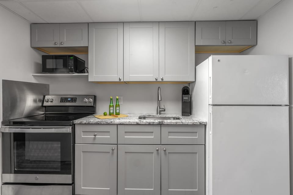 Fully-equipped kitchen with stainless steel appliances, perfect for cooking up a storm. 
