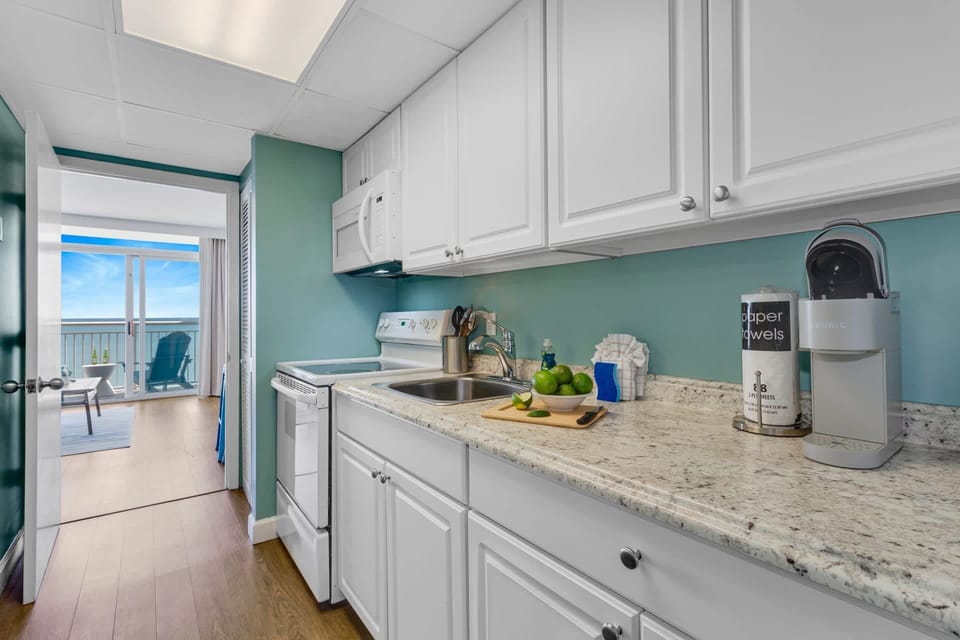 Prepare meals w/ a view in our fully-equipped kitchenette, complete w/ modern appliances & sleek granite countertops. Whether you're brewing morning coffee or fixing a quick snack, enjoy seamless access to a stunning  balcony for dining al fresco.