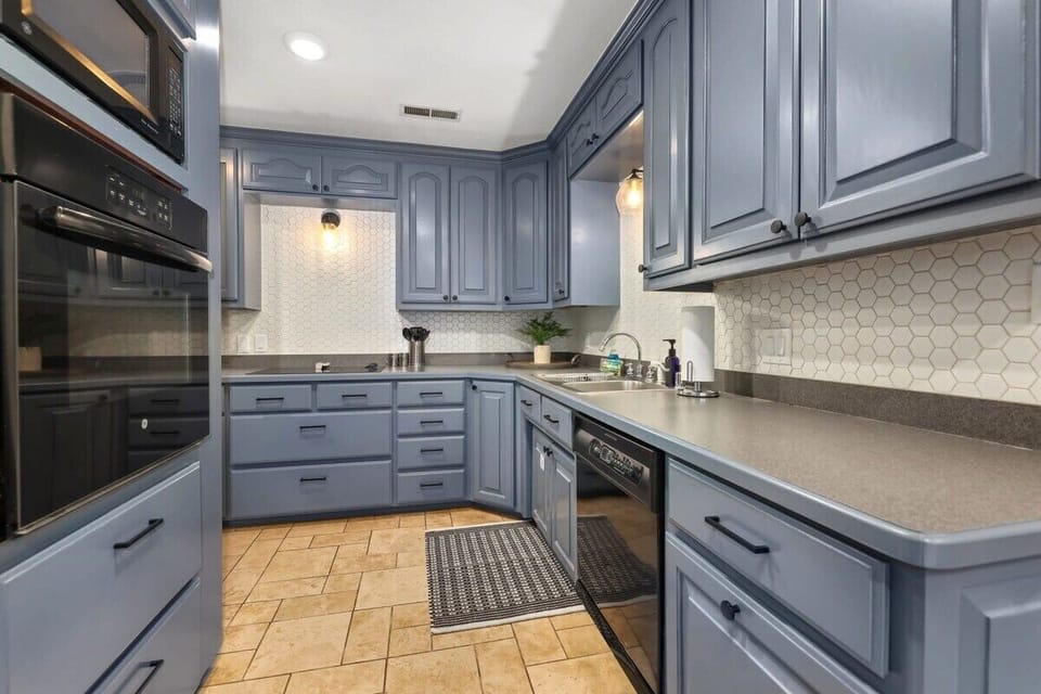 To the left of the bar area, sits our large, L-shaped kitchen.