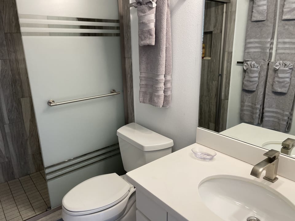 2nd. Bathroom also has a tiled walk-in shower and quartz countertop.