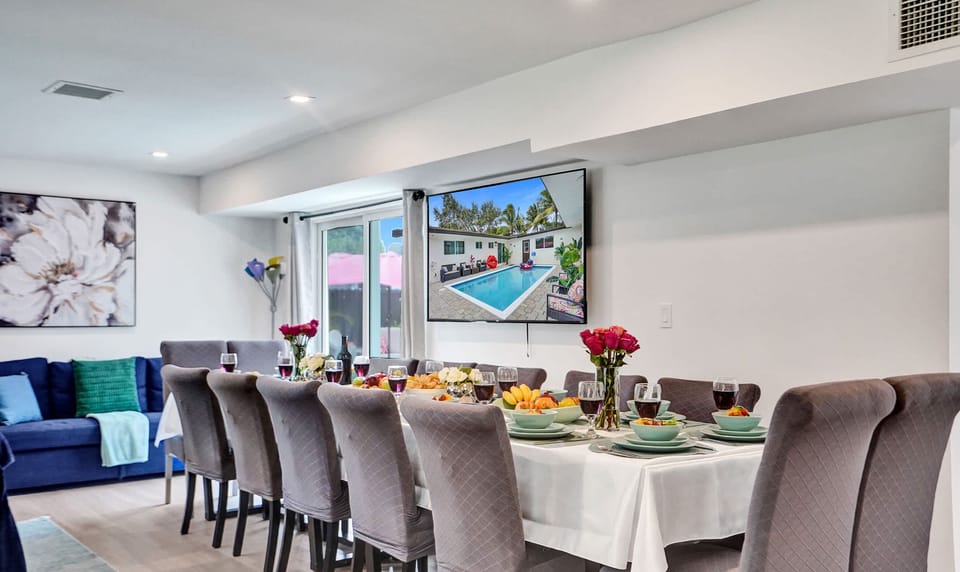 Gather around our spacious dining table, with seating for up to 14 guests, perfect for family meals and celebrations.