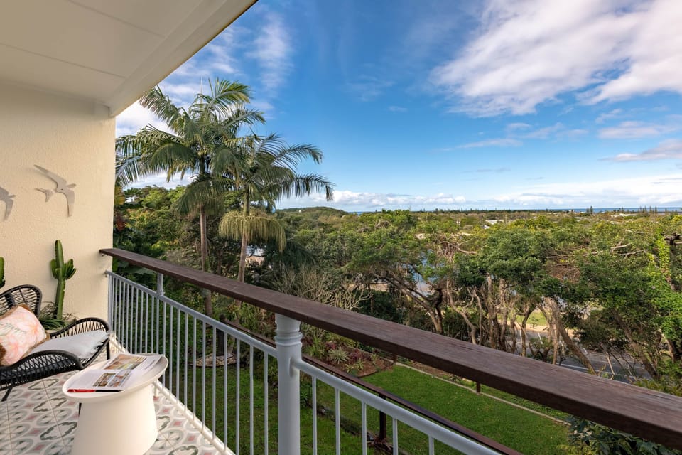 Private balcony with tropical gardens and Shaws Bay and ocean views.