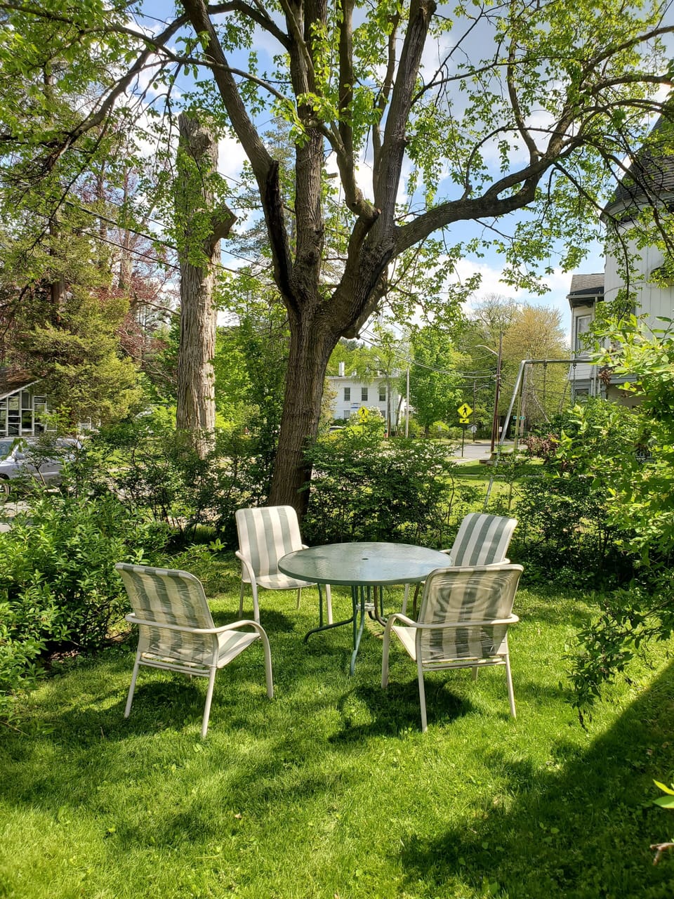 There is a shared outside eating area and grill.