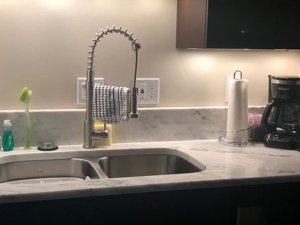 Kitchen essentials are provided including dishes and utensils