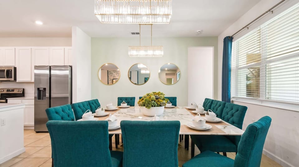 Elegant dining space with plush seating, chic décor, and perfect for group gatherings!