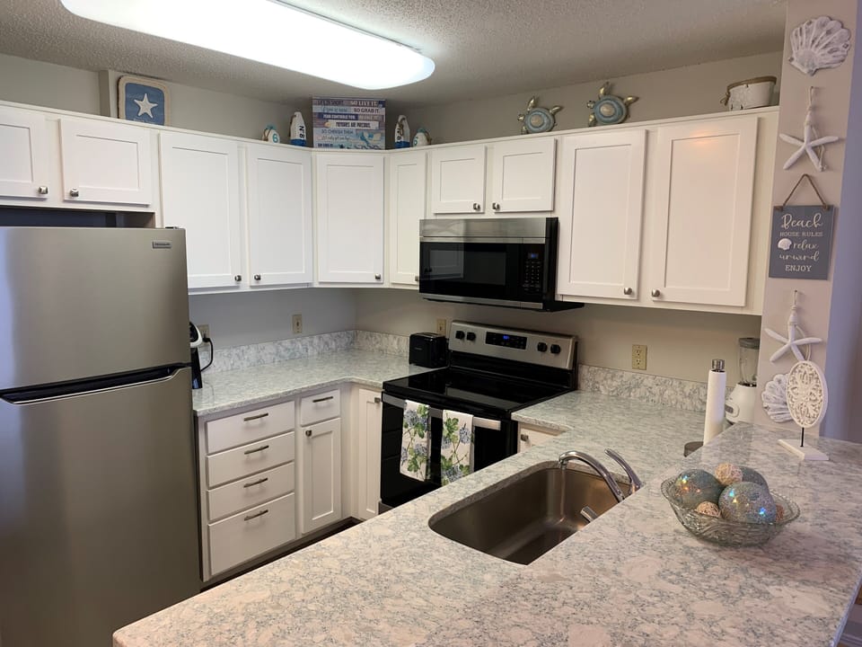 Kitchen with new appliances and granite counter tops