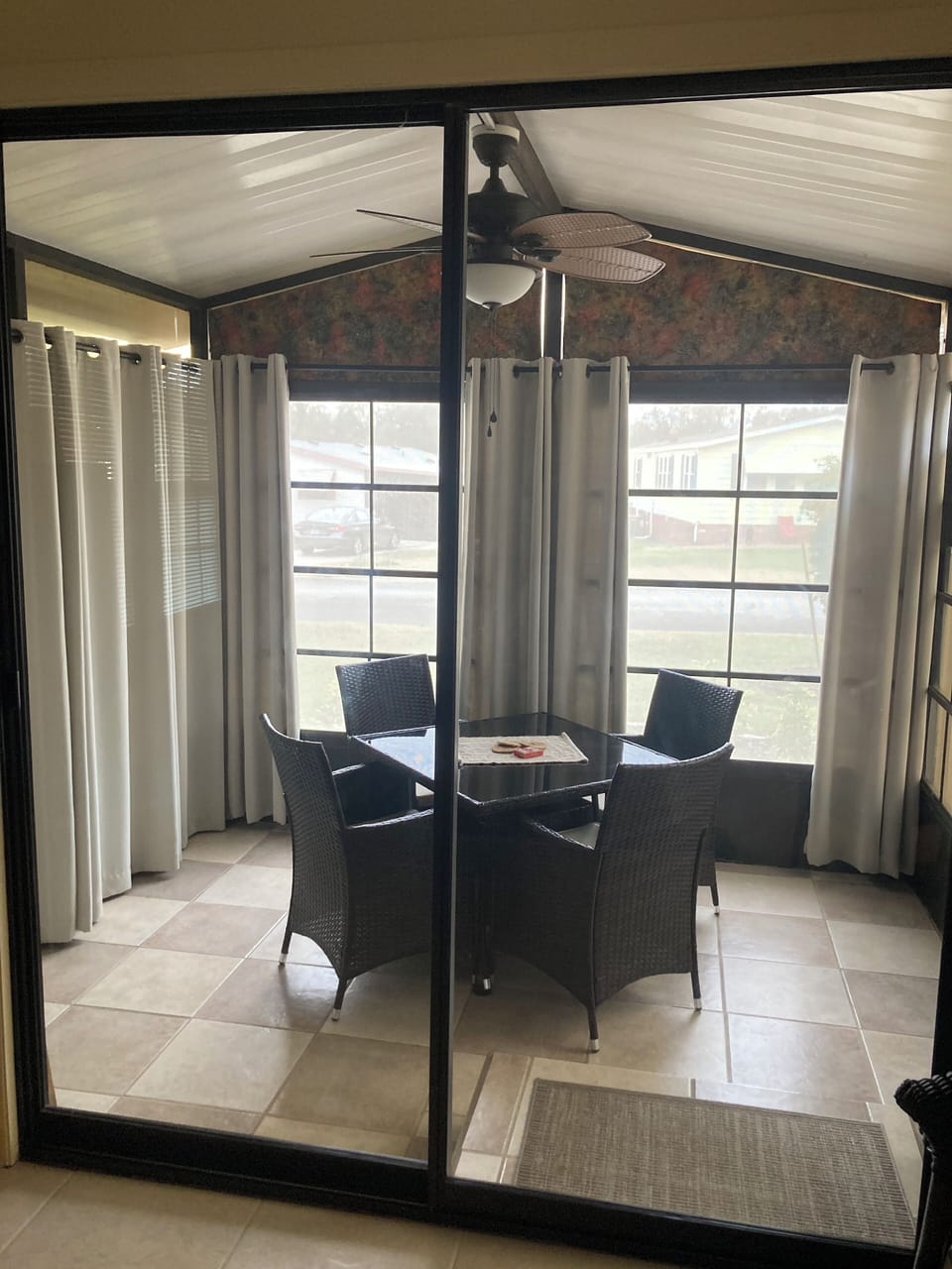 Enclosed lanai next to LR has privacy screens, and access to front patio.