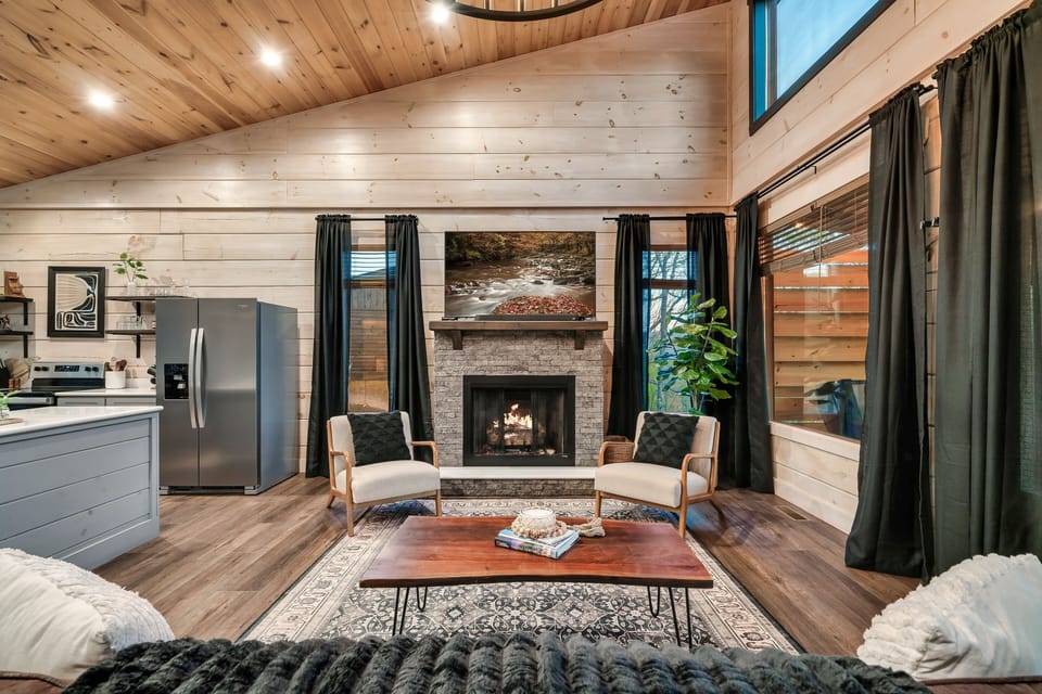 Enjoy mountain views by the fireplace with stylish seating and modern decor. 