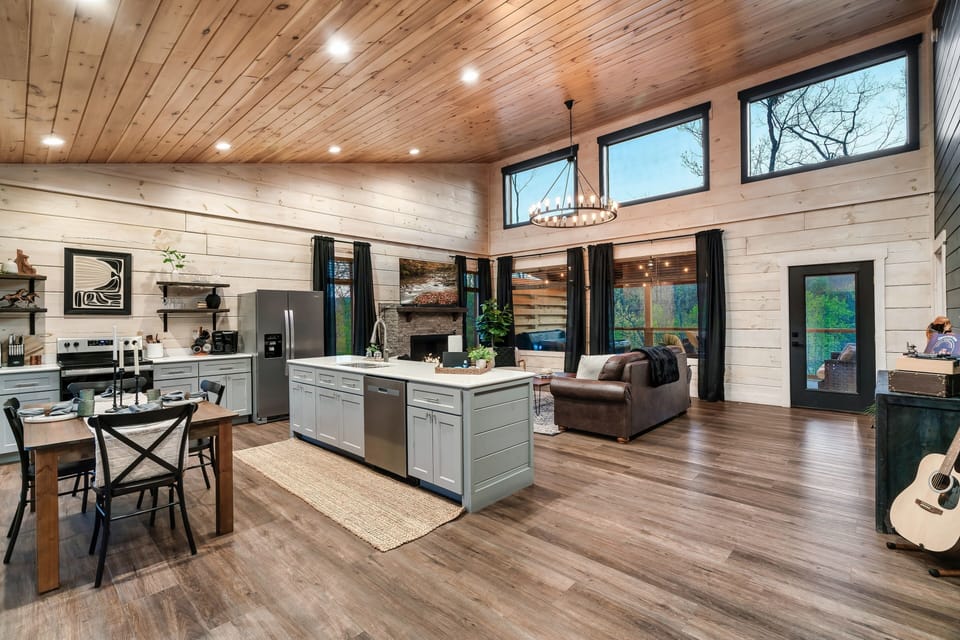 Open concept living- dining-kitchen with private deck entrance. 