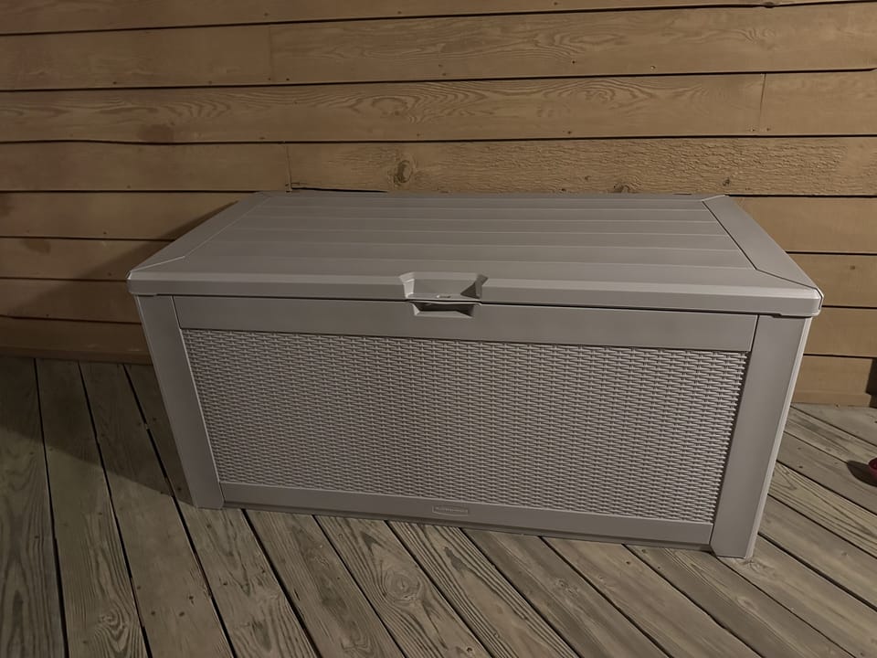 new deck box (2024) that contains chairs, sand toys, boogie boards, etc.