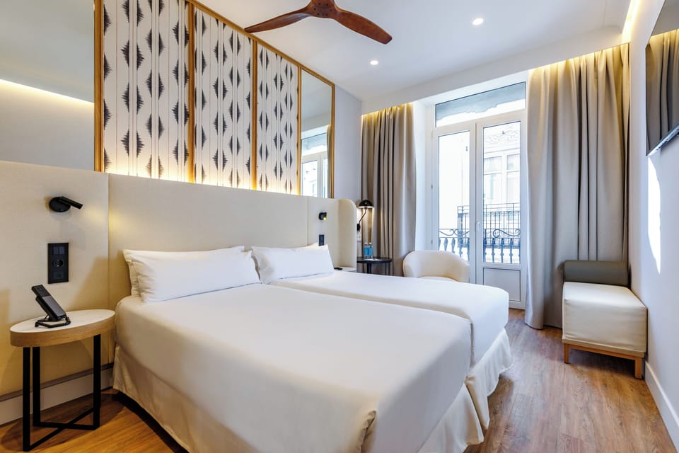 Standard Double Room | Minibar, in-room safe, desk, blackout drapes