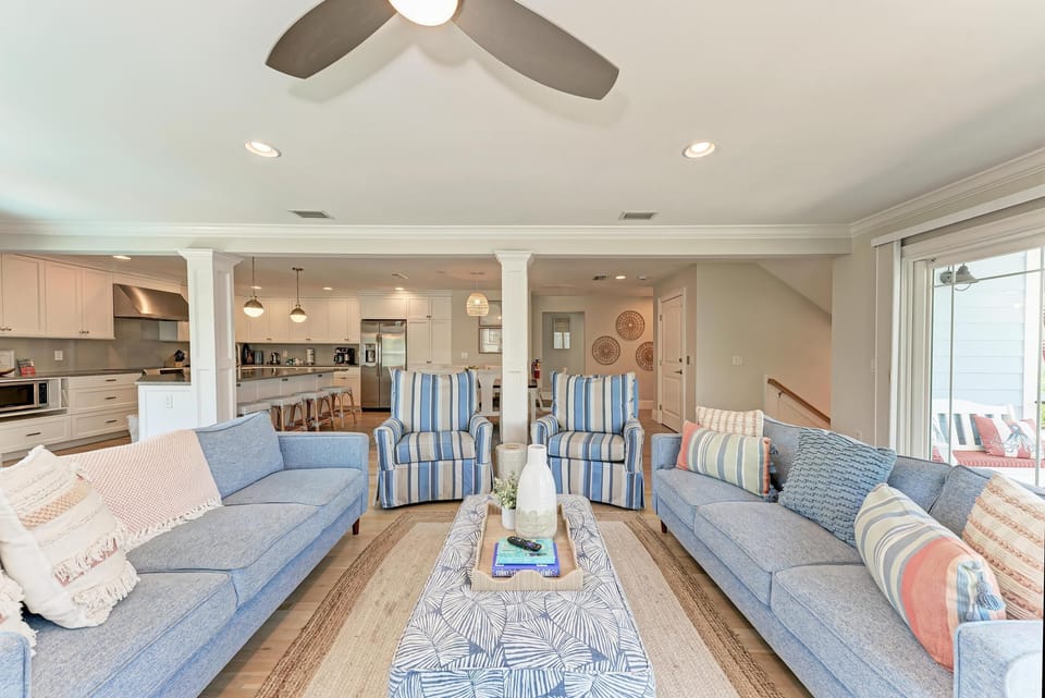 View of living room looking toward dining and kitchen area