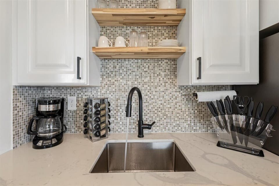 Designer stone backsplash and ALL NEW appliances