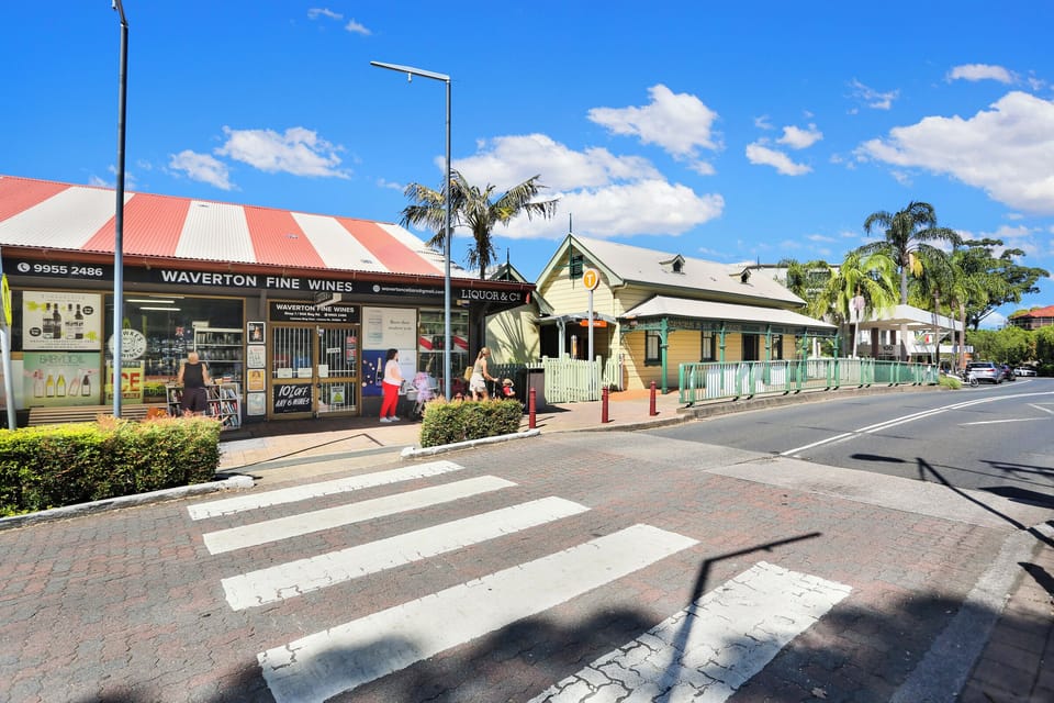Shops and train station with the apartment building behind